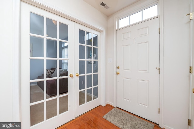 entrance foyer featuring french doors and wood-type flooring