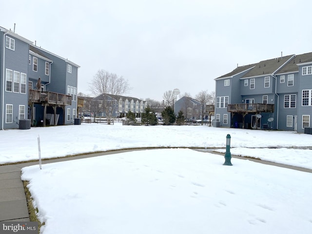 snowy yard with cooling unit