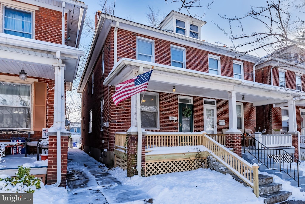 townhome / multi-family property with covered porch