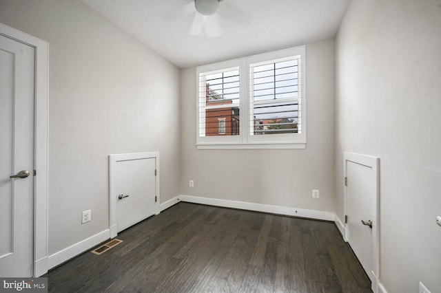 unfurnished room featuring ceiling fan, dark wood-type flooring, and vaulted ceiling