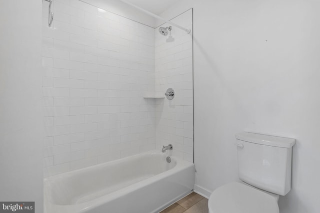 bathroom featuring tile patterned floors, toilet, and shower / bath combination