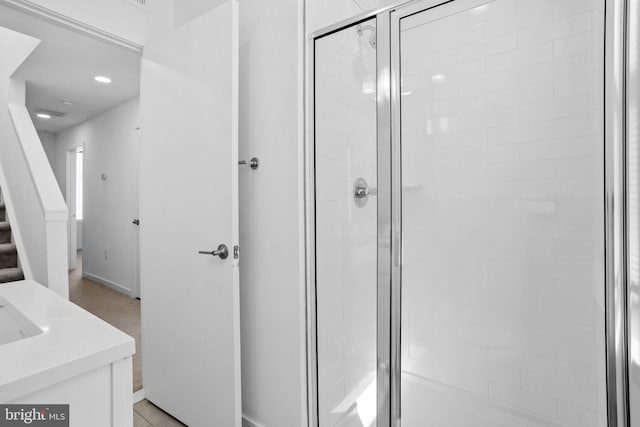 bathroom featuring vanity and walk in shower