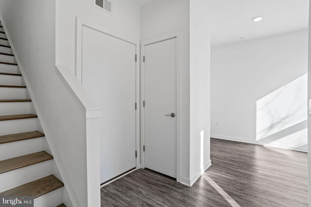 staircase featuring hardwood / wood-style flooring