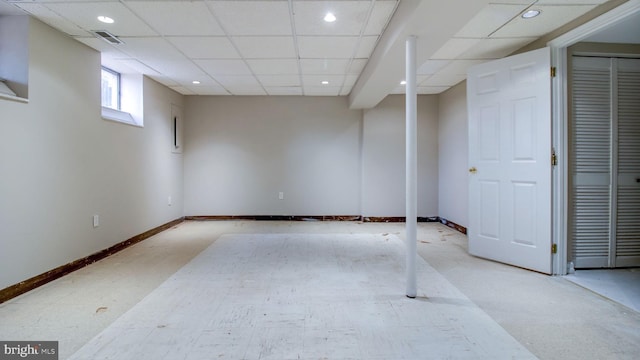 basement with recessed lighting, a drop ceiling, baseboards, and visible vents