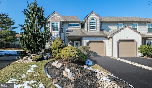 townhome / multi-family property featuring a garage