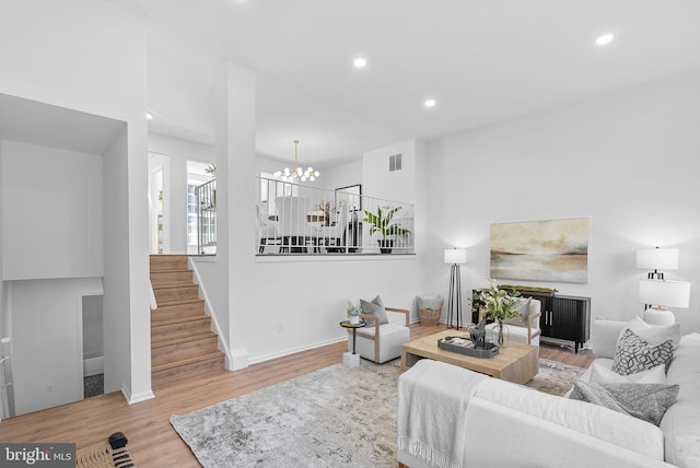 living room featuring hardwood / wood-style floors and a chandelier