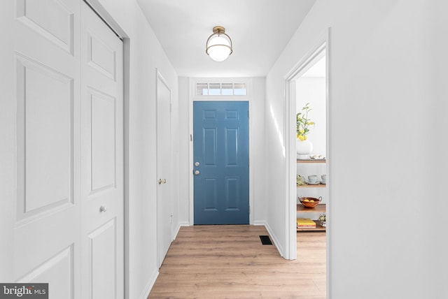 foyer with light hardwood / wood-style flooring