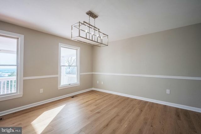 empty room with light hardwood / wood-style floors