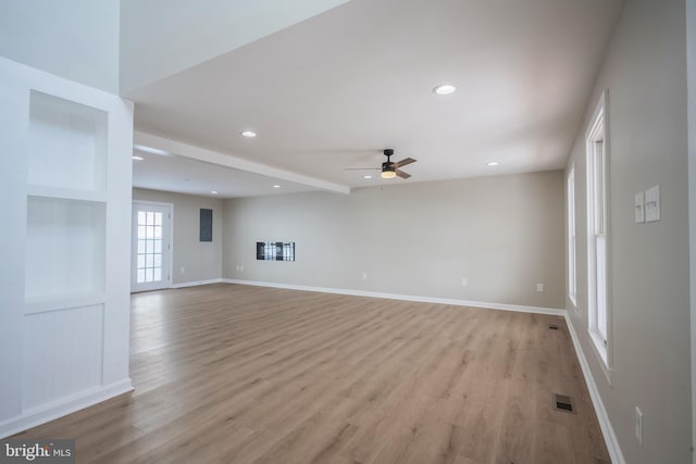 unfurnished living room with ceiling fan and light hardwood / wood-style flooring