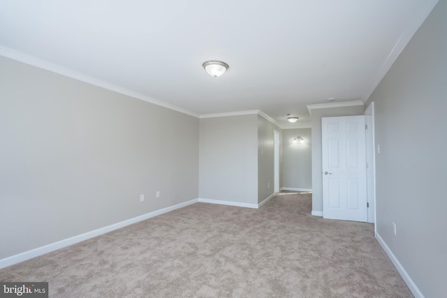 carpeted empty room with crown molding