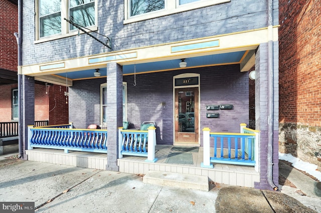 doorway to property featuring covered porch