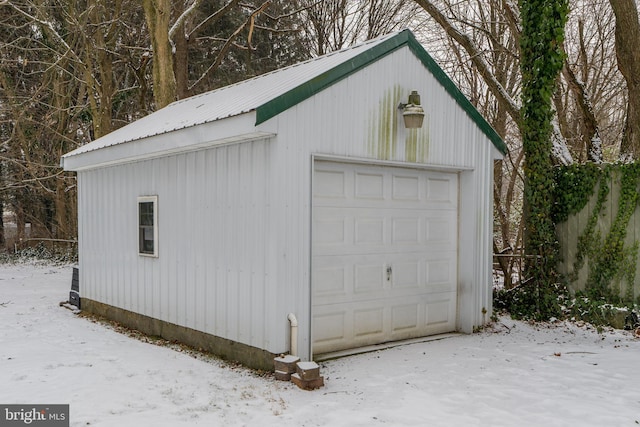 view of snow covered garage