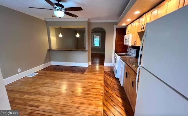 kitchen with ceiling fan, pendant lighting, light hardwood / wood-style floors, white appliances, and ornamental molding