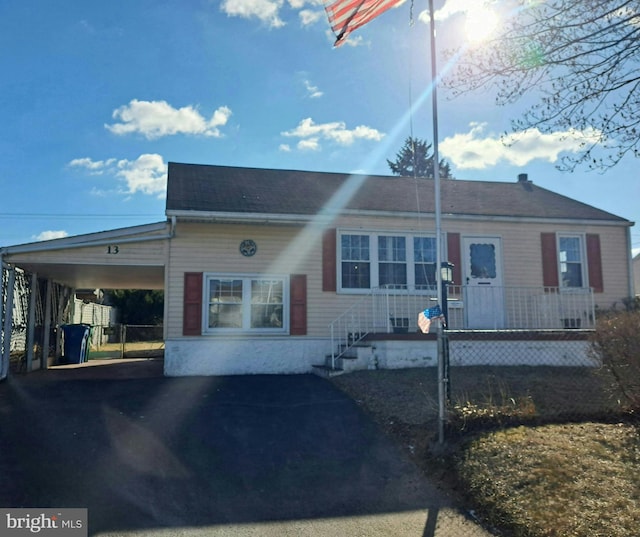 view of front of property featuring aphalt driveway and an attached carport