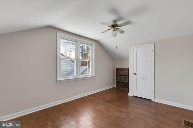 bonus room with vaulted ceiling, ceiling fan, and dark hardwood / wood-style floors