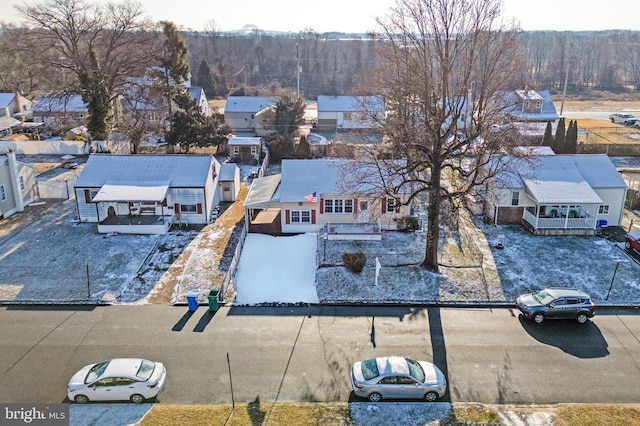 aerial view featuring a residential view and a wooded view