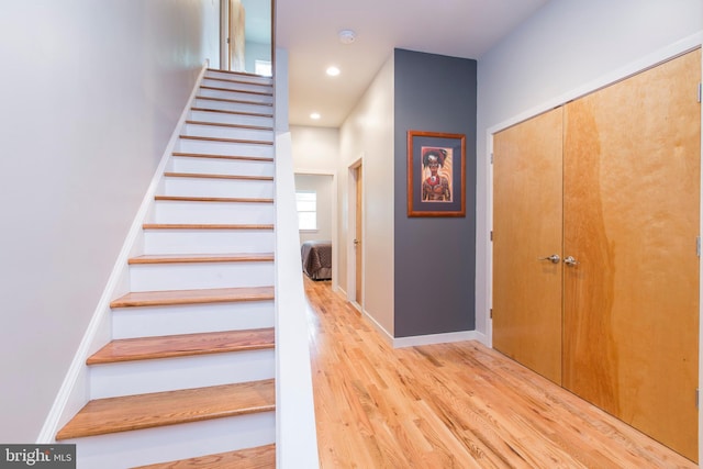 staircase featuring wood-type flooring