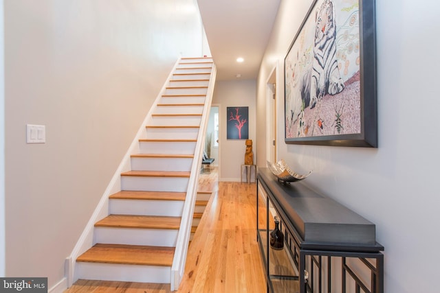 staircase featuring hardwood / wood-style flooring