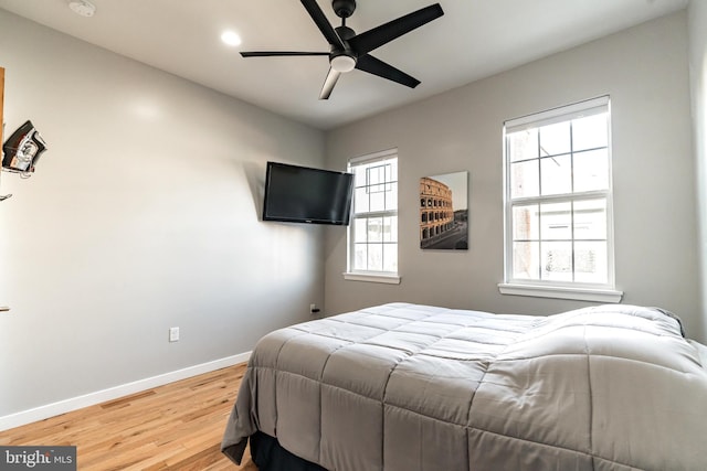 bedroom featuring hardwood / wood-style floors and ceiling fan