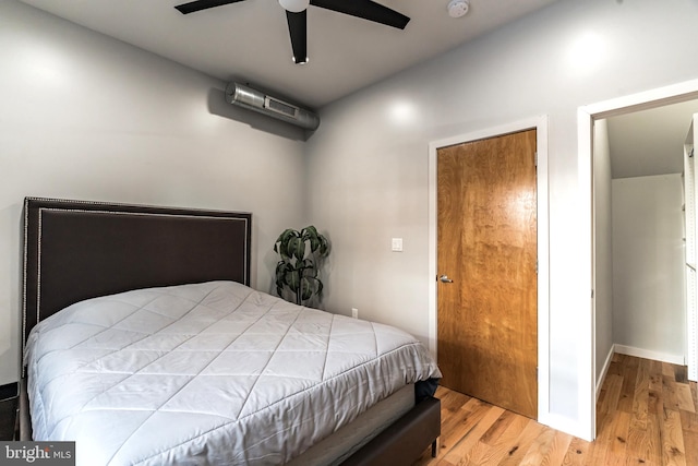 bedroom featuring ceiling fan and light hardwood / wood-style flooring