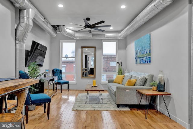 sitting room with light hardwood / wood-style flooring and ceiling fan