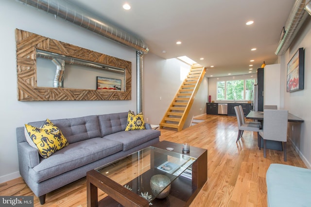 living room with light hardwood / wood-style flooring