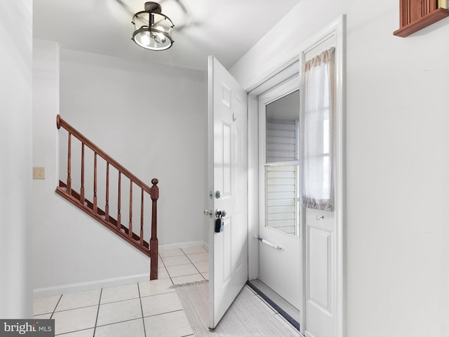 entrance foyer featuring plenty of natural light and light tile patterned floors