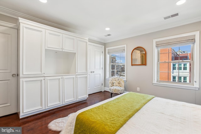 bedroom with multiple windows, ornamental molding, and dark hardwood / wood-style floors