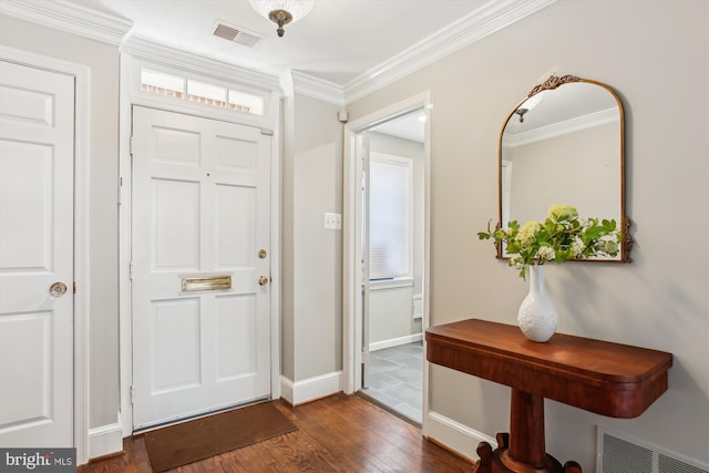 foyer entrance with crown molding and dark wood-type flooring