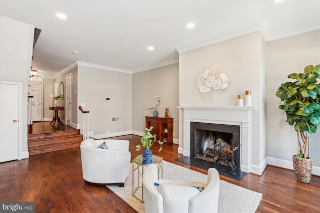 living room featuring dark wood-type flooring and ornamental molding