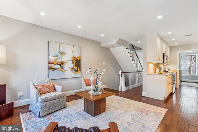 living room featuring dark hardwood / wood-style flooring