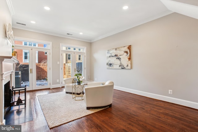 living room with french doors, ornamental molding, and dark wood-type flooring