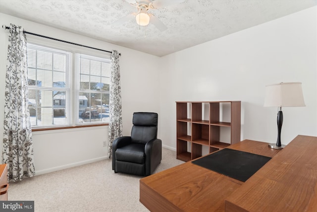 interior space with light carpet, a textured ceiling, and ceiling fan