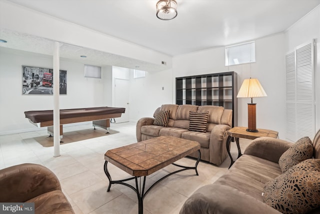 living room with ornamental molding and pool table