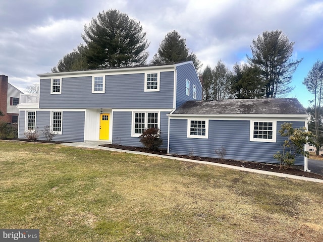 view of property with a front lawn