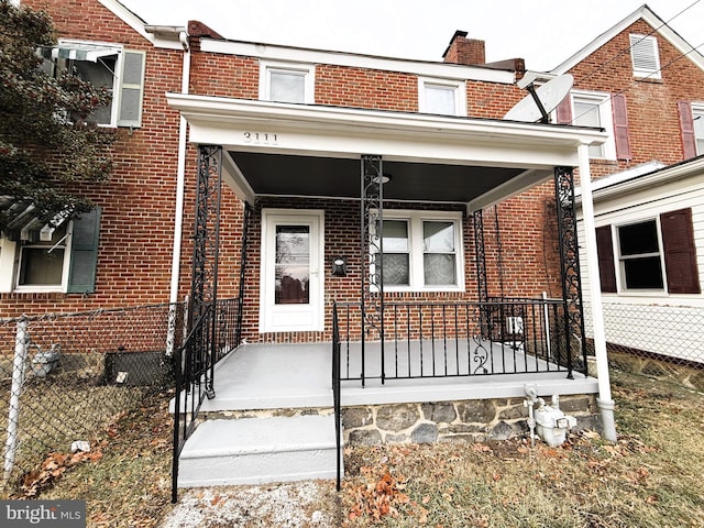 property entrance featuring covered porch