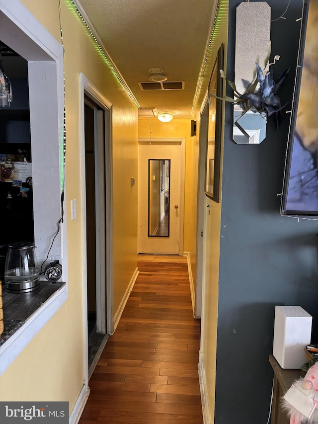 hallway featuring hardwood / wood-style floors