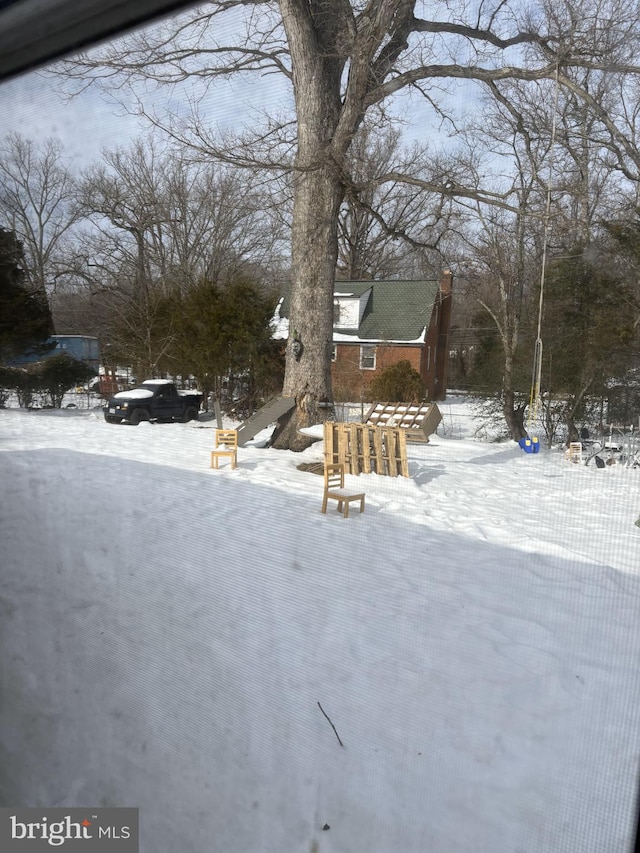 view of yard layered in snow