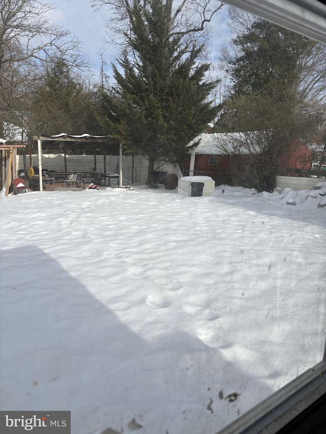 view of yard layered in snow