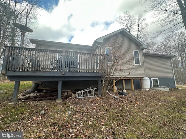 back of property featuring a deck