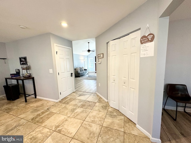 corridor featuring light tile patterned floors