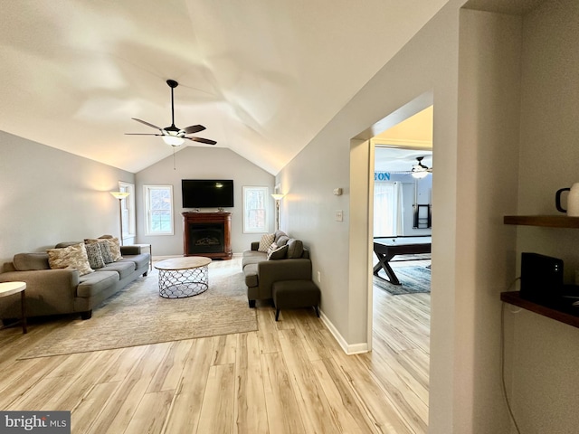 living room featuring ceiling fan, light wood-type flooring, billiards, and vaulted ceiling