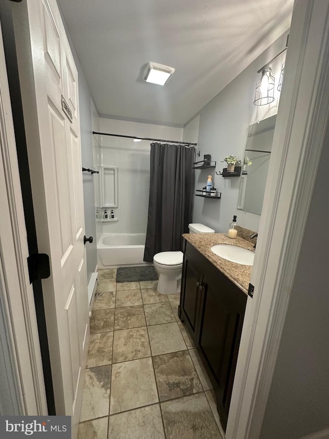 full bathroom with vanity, shower / bath combination with curtain, and toilet