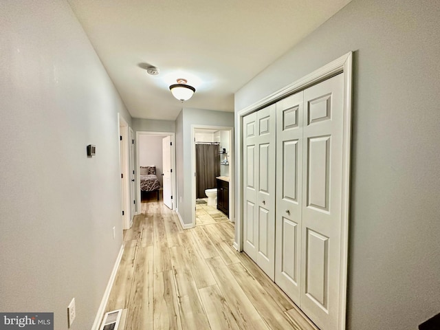 hallway featuring light hardwood / wood-style flooring