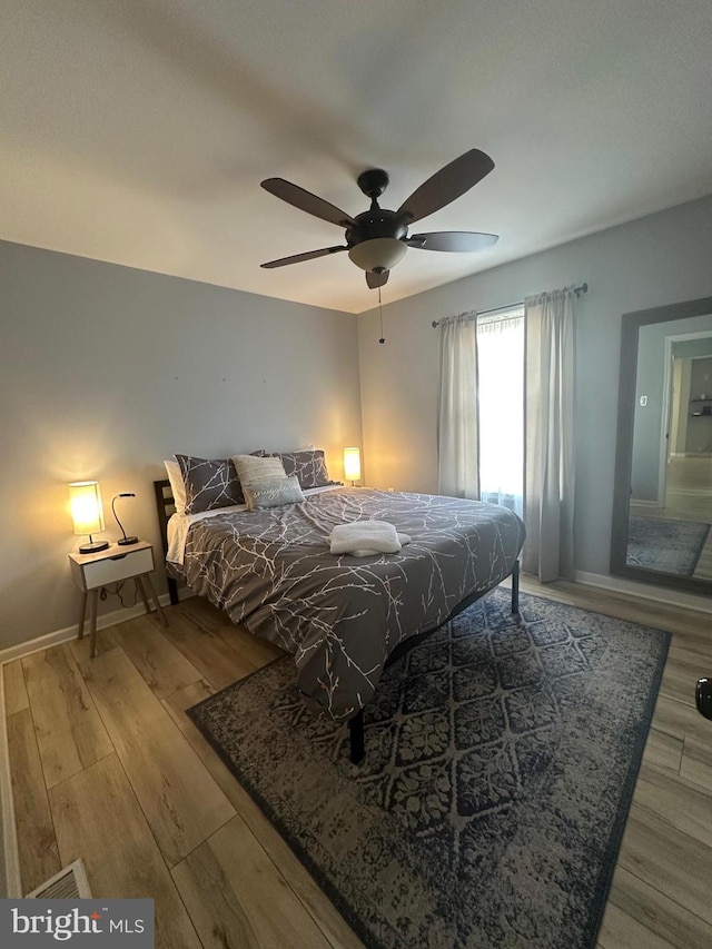 bedroom featuring ceiling fan and wood-type flooring