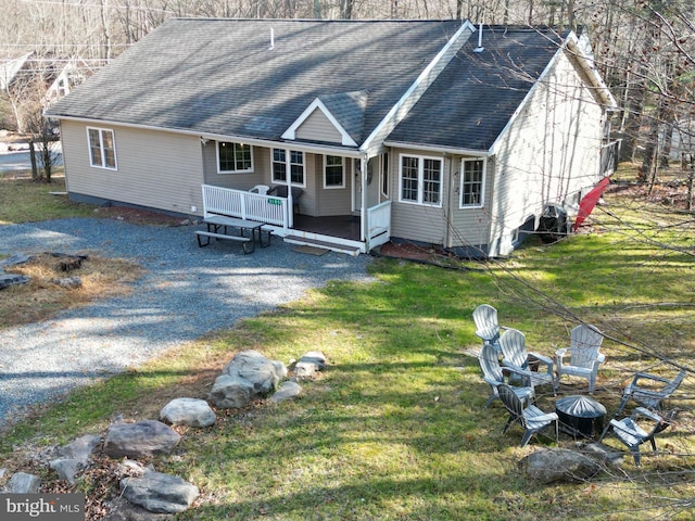 view of front of home with covered porch and a front yard