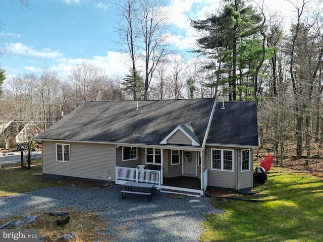 view of front of house featuring a front yard and a porch