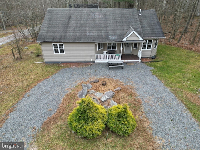 view of front of home with a front yard and a porch