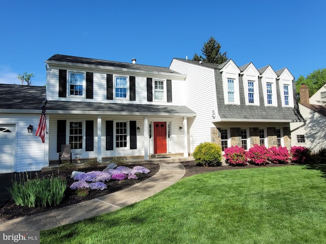 view of front of home featuring a front lawn and a porch