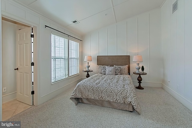 bedroom featuring light carpet